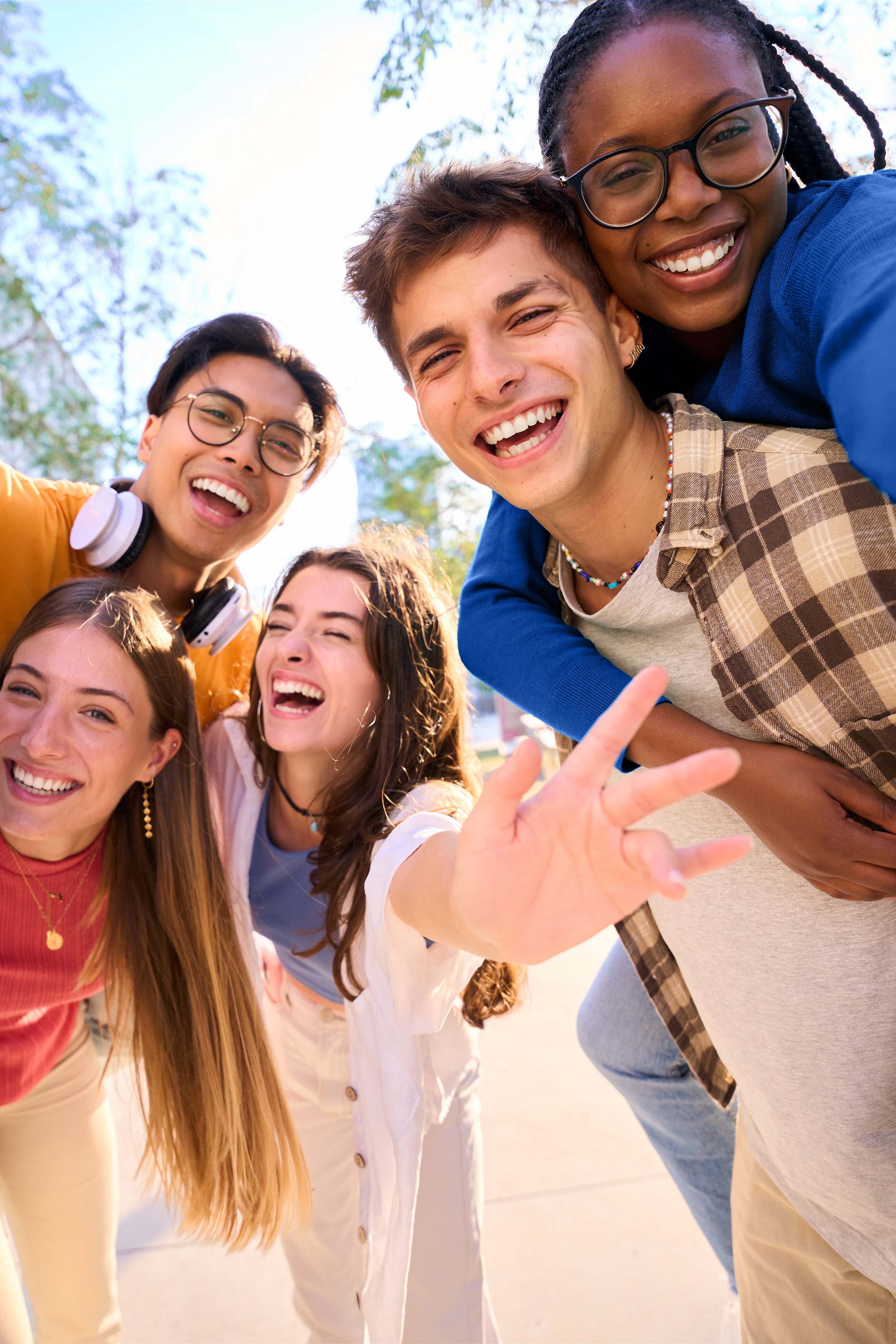 Five different laughing young persons